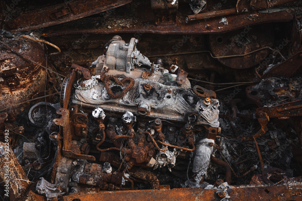 Fototapeta premium War in Ukraine, burnt civilian cars, burnt car engine, Irpin city, Kyiv region.