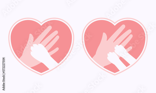 Dog and cat paws on hand in heart shaped frame