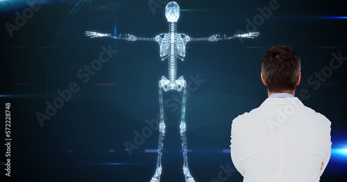 Composition of male doctor using virtual screen with skeleton model