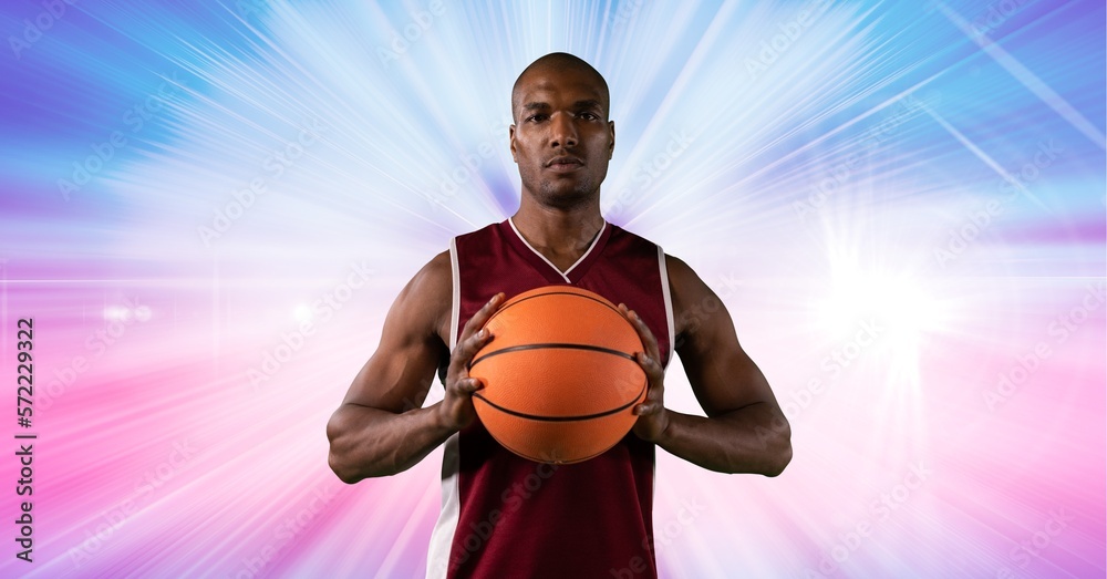 Composition of male basketball player holding basketball with copy space Composition of male basketball player holding basketball with copy space