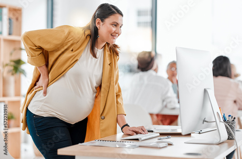 Pregnant, computer and business woman typing in office workplace working on project. Pregnancy, maternity and happy worker, female or mother on desktop planning, research or writing report in company photo