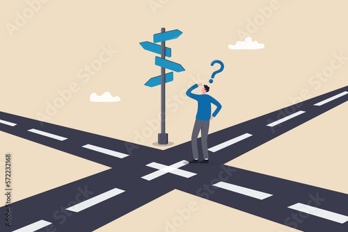 Business crossroads, finding solution or direction for success, confusion or what next challenge, opportunity choice or alternative concept, confused businessman at the crossroads thinking way to go. photo