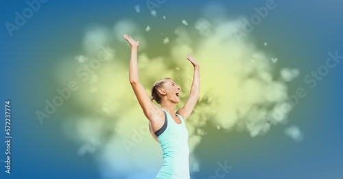 Composition of smiling fit caucasian female athlete celebrating win with copy space