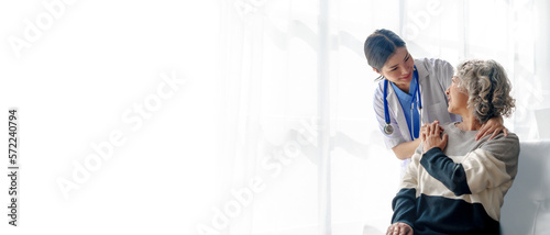 Obraz na plátne Young asian caretaker with 60s asia elderly woman consulting and encourage, take