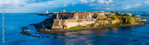 A panorama view of the fortifications approaching the harbour entrance in San Juan, Puerto Rico on a bright sunny day photo