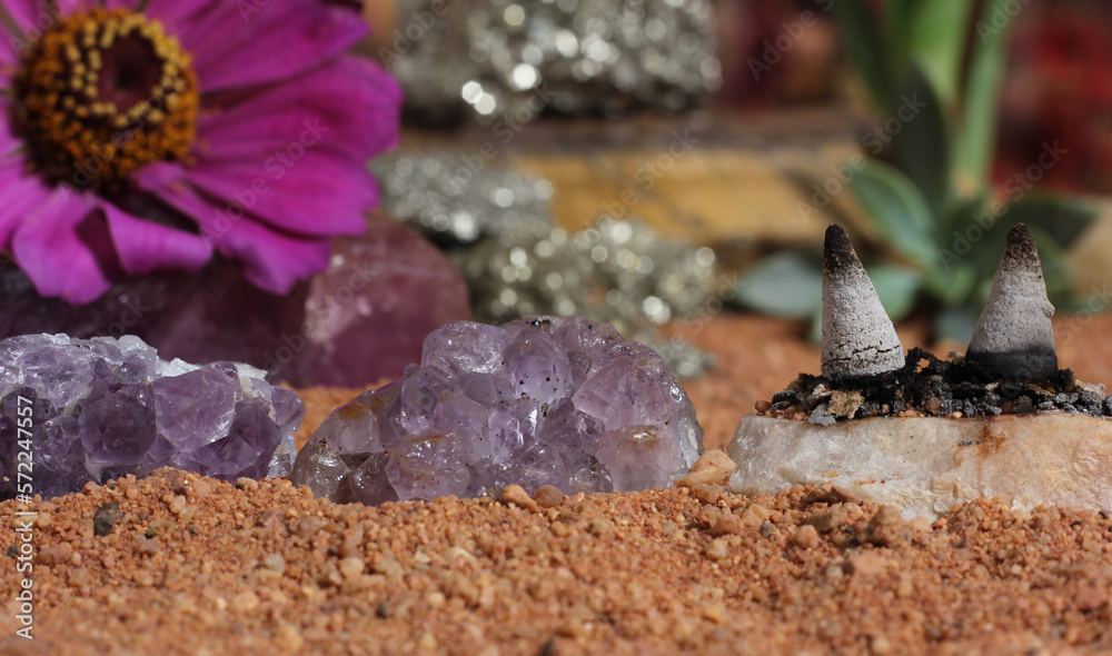 Obraz premium Amethyst Crystals and Chakra Stones on Australian Red Sand. Meditation Table