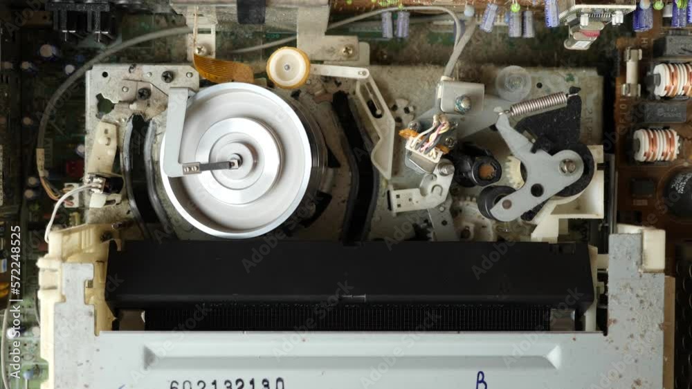 Unloading the VHS cassette and the operation of the tape extension mechanism of the video player. View from above. Video imaging technologies. Unloading the VHS cassette and the operation of the tape extension mechanism of the video player. View from above. Video imaging technologies.