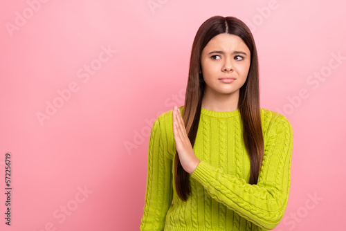 Photo portrait of cute young girl avoid no gesture reject refuse indifferent wear trendy green outfit isolated on pink color background