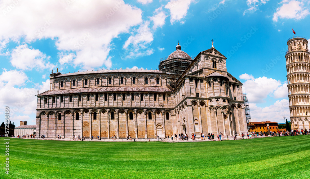 Picturesque landscape with San Giovanni Baptistery, part of cathedral or Duomo di Santa Maria Assunta near famous Leaning Tower in Pisa, Italy. fascinating exotic amazing places. Piazza dei Miracoli.