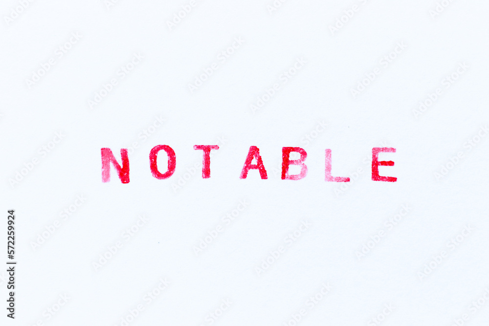 Fototapeta premium Red color ink rubber stamp in word notable on white paper background