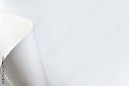 Abstract white layout. Design element for advertising and promotional. Paper or page turning over bottom right. background with sharp shadows photo