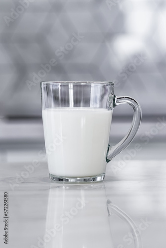 Glass of fresh yogurt in a glass cup. vertical © Sergey