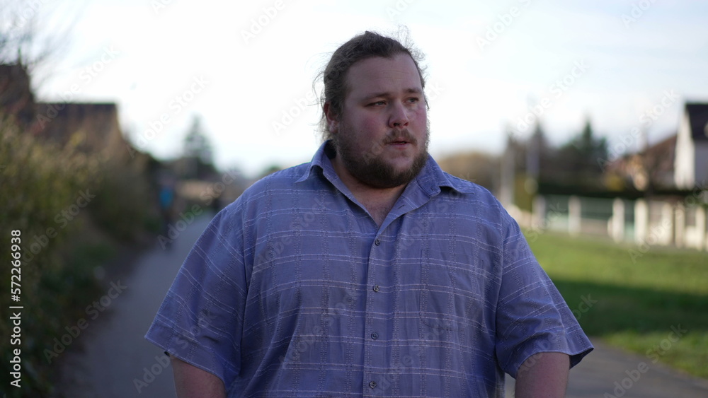 One upset man receiving BAD news on cellphone while walking outside in street. Angry frustrated male person reacting negatively to message notification One upset man receiving BAD news on cellphone while walking outside in street. Angry frustrated male person reacting negatively to message notification