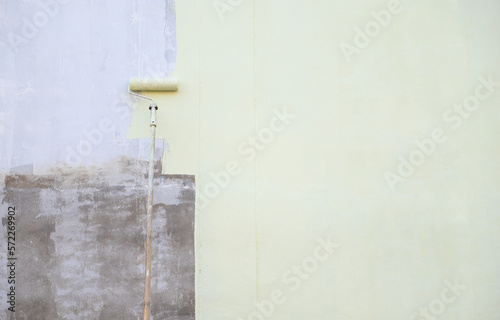 Painting brush moving on wall for paint the old color in new tone of decoration