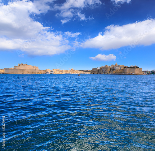 Grand Harbour seascape in Valletta, capital of Malta: view of Birgu, an old fortified city, with Fort Saint Angelo at its head and the city of Cospicua at its base. 