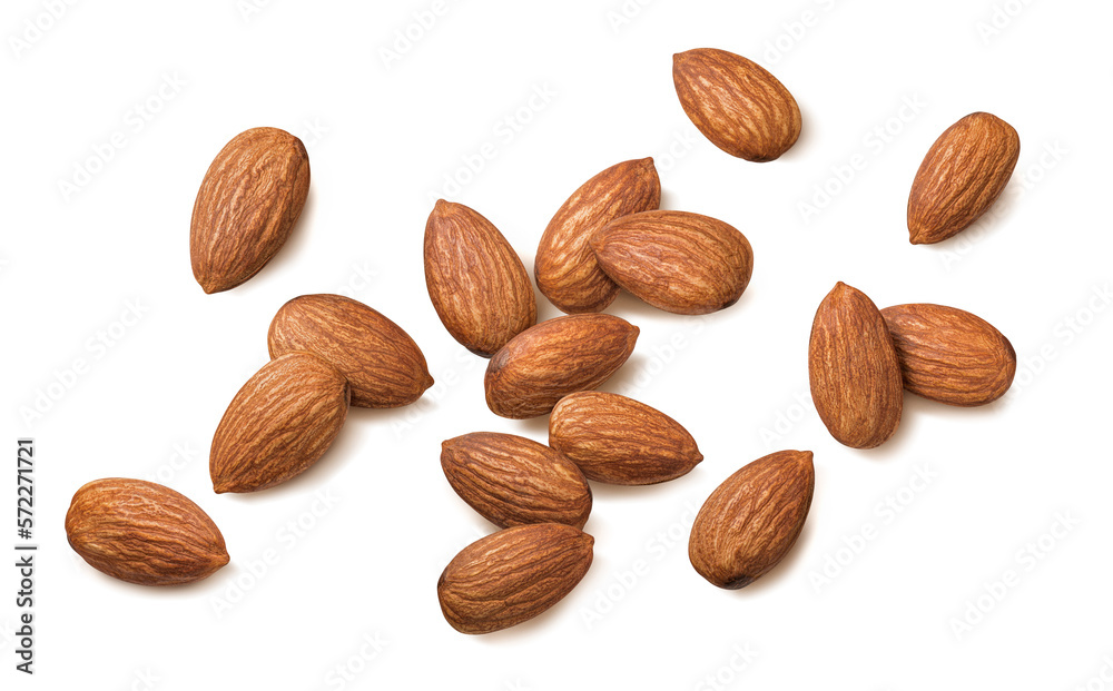 Single whole almonds scattered isolated on white background. Top view Single whole almonds scattered isolated on white background. Top view
