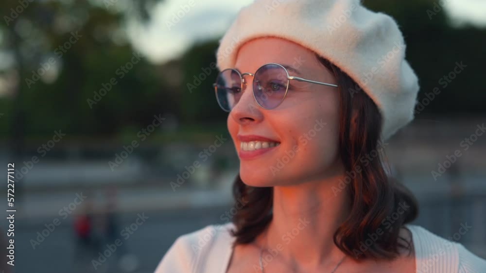 Portrait of a beautiful young girl looking at a pink sunset Portrait of a beautiful young girl looking at a pink sunset