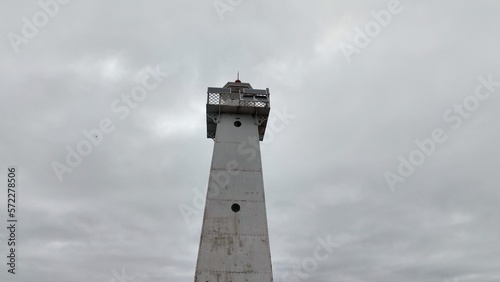 Historic Lighthouse at Sodus Bay New York by Lake Ontario during Winter under grey skies