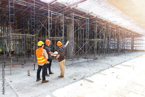 Wallpaper Mural Concept of construction. Engineer, architect and designer working together at the construction site, Foreman or engineer checking the accuracy of the construction work by using blueprints.. Torontodigital.ca