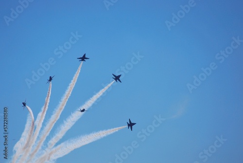 Air force fighter planes on display and doing aerial maneuvers