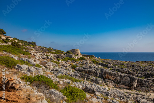 Gagliano del Capo. The beautiful panorama on the blue sea, from the rocky cliff of Salento. An old stone trullo. The nature trail that leads from the Ciolo bridge to the spectacular Cipolliane caves. photo