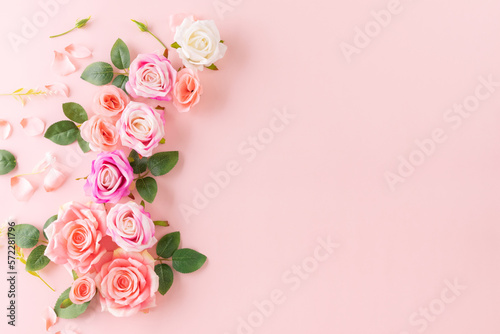 Happy Women's Day decoration concept made from rose flower on pastel background. © Cherdchai