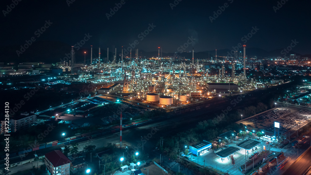 industrial area production plant or refinery crude oil and gas for transportatioon and export, aerial photography at night scene from drone,