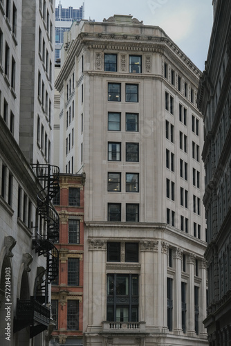 Historic and modern minimalistic building facade architecture in downtown Boston, Massachussetts with Art Deco elements, Pilars, domes, churches, skyscraper skyline contrast detail window view