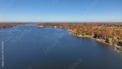 Irondequoit Bay, New York by Lake Ontario outside during Autumn Season with Fall colors on landscape © Steve