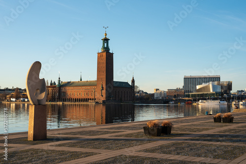 Stockholm City Hall (Stockholms stadshus) on sunny evening with Solbåten (The sun boat) by Christian Berg