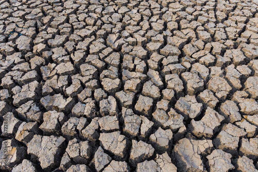 drought land.Land with dry and cracked desert ground, global warming background.Concepts global warming problem resolution with over cracks soil . drought land.Land with dry and cracked desert ground, global warming background.Concepts global warming problem resolution with over cracks soil .