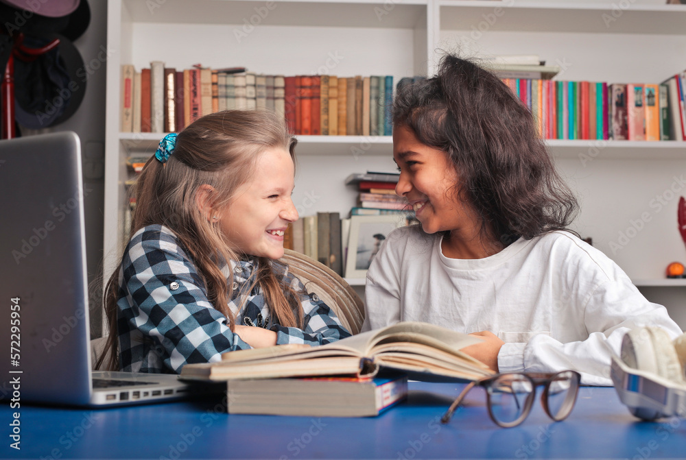 portrait of two little girls joking with each other portrait of two little girls joking with each other