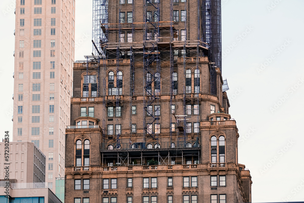 Fototapeta premium Architecture Building Skycrapper Urban office downtown sky facade windows residential apartment rental leasing sale concrete wall bricks construction tourism