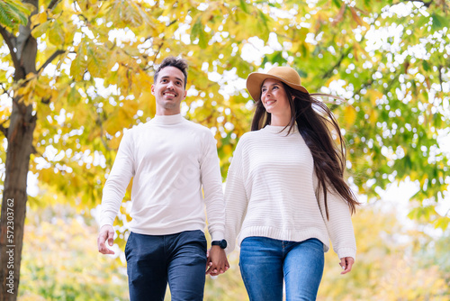Young couple in loving couple strolling in the park