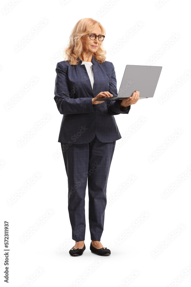 Mature professional woman standing with a laptop Mature professional woman standing with a laptop