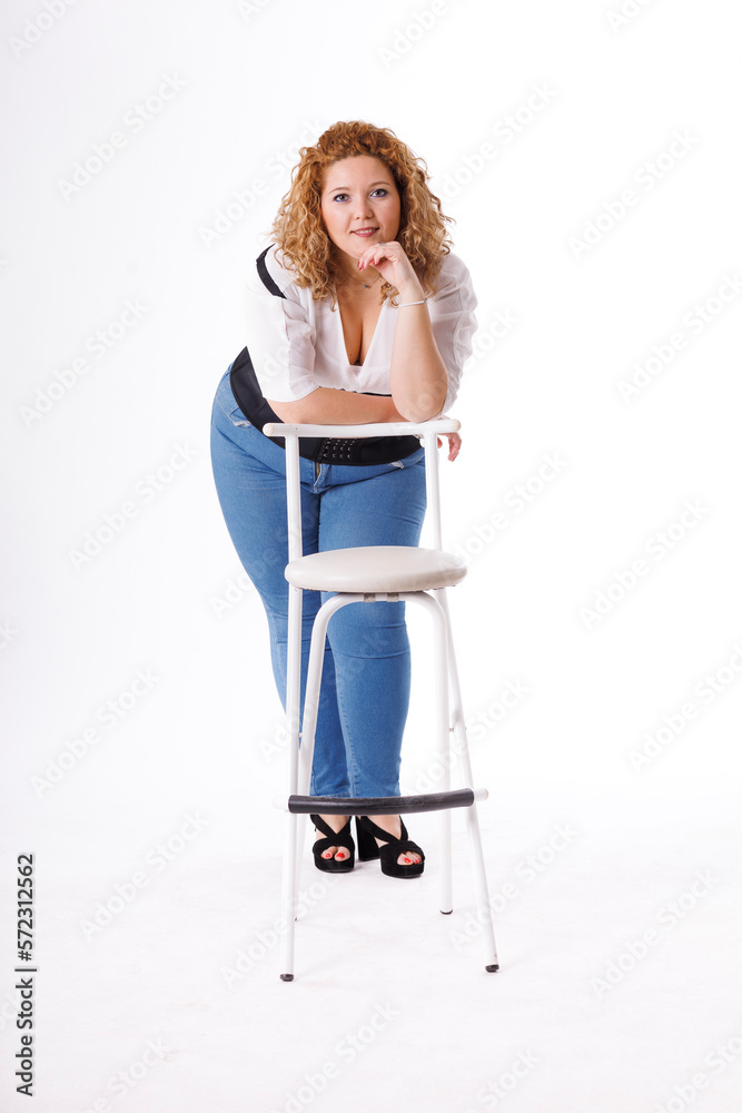 Plus size fashion model, fat woman in denim clothes and white shirt on white background, overweight female body