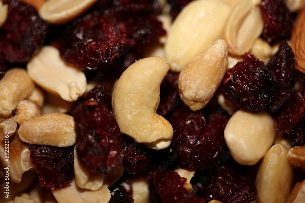 Mix of dried cranberries fruits almonds and nuts in a bowl close up modern background high quality big size stock photos prints Mix of dried cranberries fruits almonds and nuts in a bowl close up modern background high quality big size stock photos prints