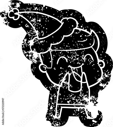 cartoon distressed icon of a man laughing wearing santa hat