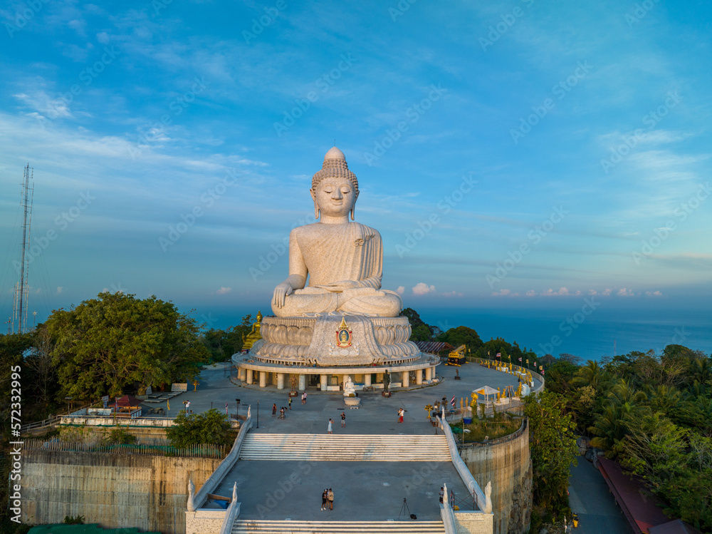 Fototapeta premium aerial photography scenery blue sky and blue ocean behind Phuket white big Buddha. Phuket white big Buddha is the .famous landmark in Phuket..Aerial panoramic view landscape Phuket big Buddha.