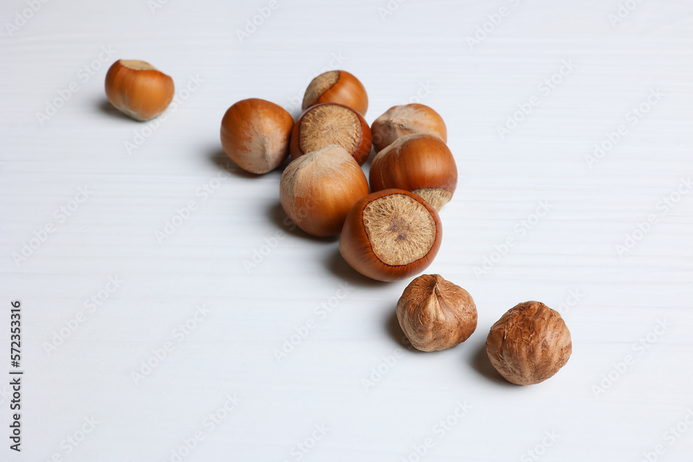 Background for food with hazelnuts, hazelnuts on a light wooden table. Soft focus. Background for food with hazelnuts, hazelnuts on a light wooden table. Soft focus.