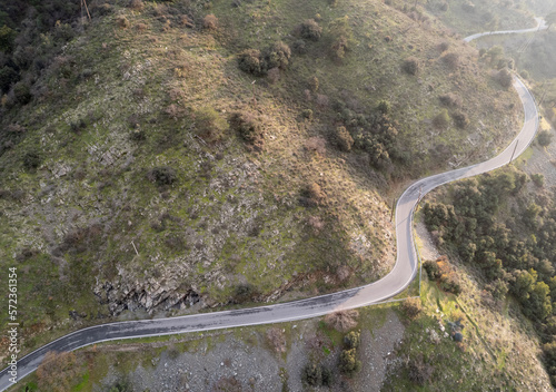 Twisty dangerous rural road in the mountains. Adventure outdoors