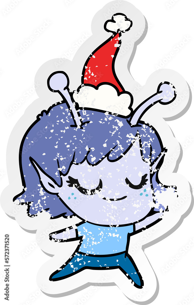 Fototapeta premium smiling alien girl distressed sticker cartoon of a wearing santa hat