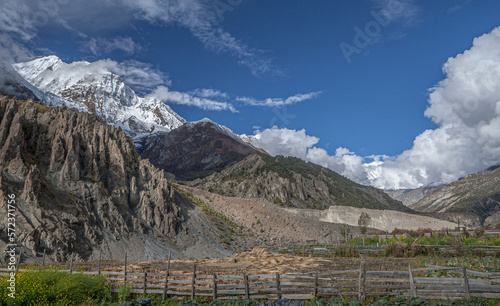 View of the high altitude plateau with  Annapurna range in clouds (in the background) on the approach to Manang village, Manang district, Around Annapurna trek, Nepal Himalayas, Nepal © MoVia1