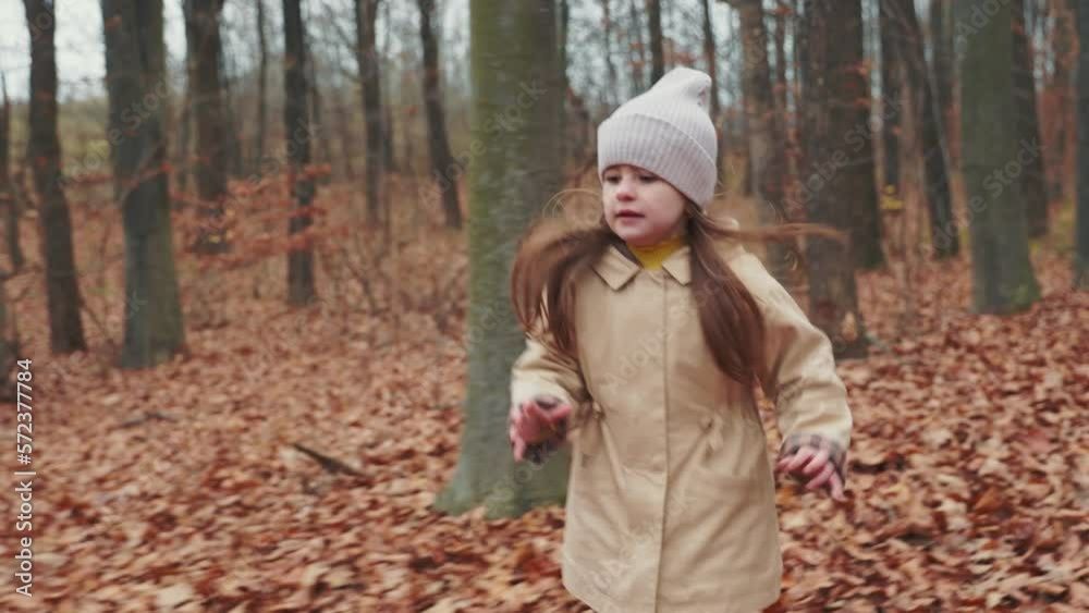 little girl running in the autumn forest little girl running in the autumn forest