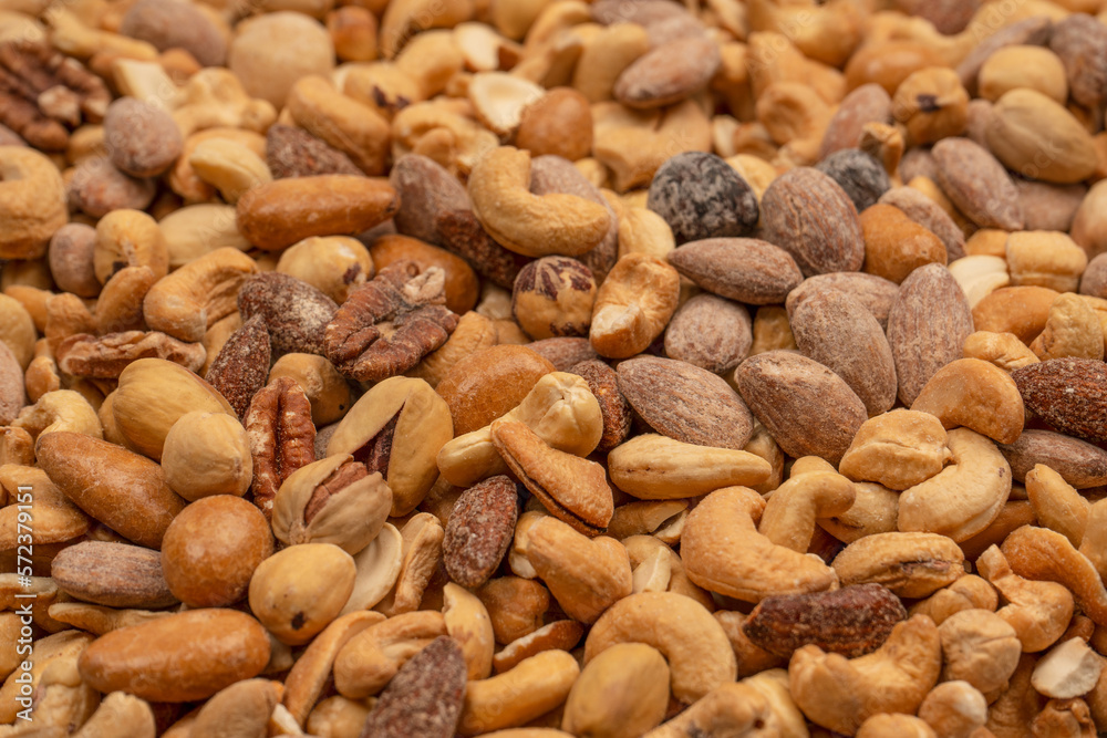 A group of almonds, pistachios, walnuts, macadamia, cashews. A group of almonds, pistachios, walnuts, macadamia, cashews.