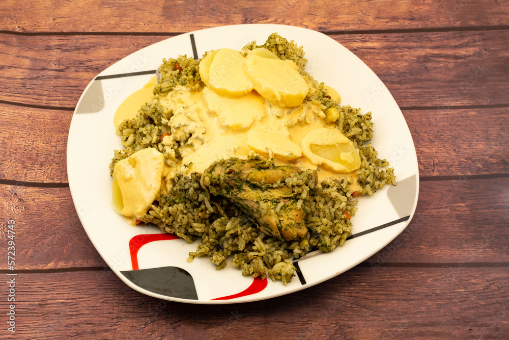 Arroz con pollo verde, with sliced yellow potatoes and huancaina cream Arroz con pollo verde, with sliced yellow potatoes and huancaina cream