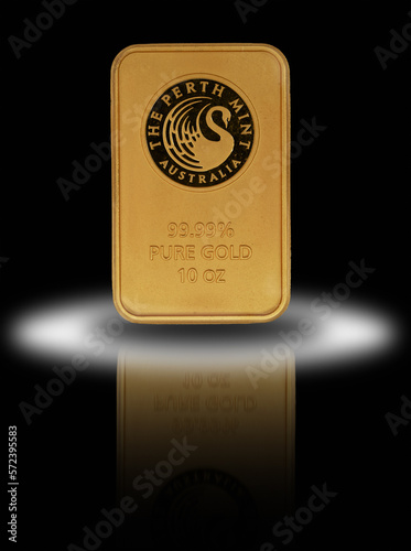 10 oz pure Gold 99.99 bar on reflective surface