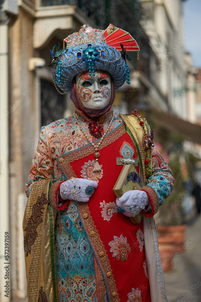 VENICE - FEBRUARY 11: A person in Venetian costume attends the Carnival of Venice, a festival starting two weeks before Ash Wednesday in Venice, Italy.