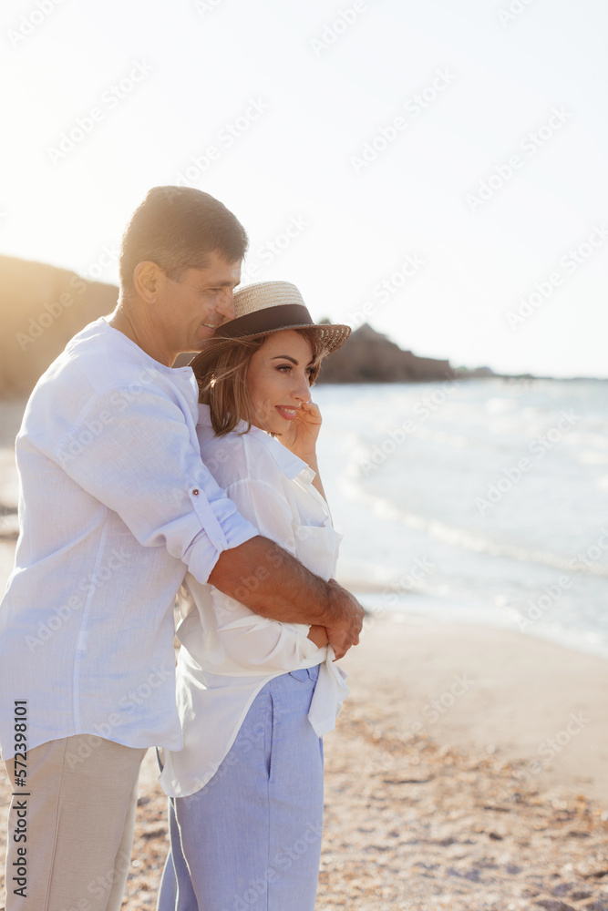 Happy romantic middle aged couple are by the sea. Lifestyle Concept. Closeup photo.