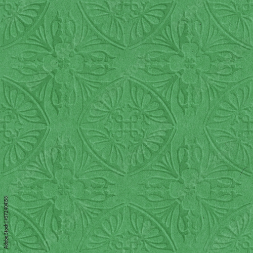 Cardboard background with an embossed floral pattern. Elegant background in green tones. Best for St.Patrick Day.